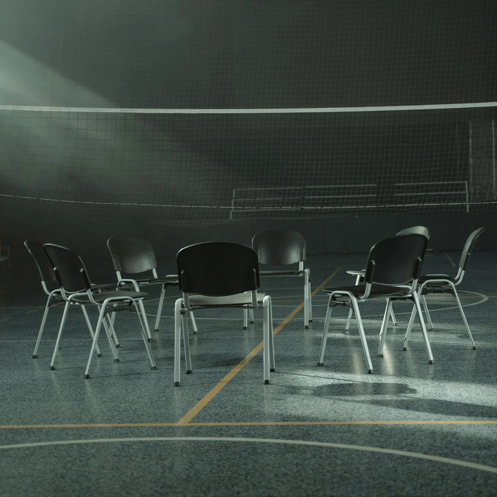 Empty chairs arranged in a circle for group therapy