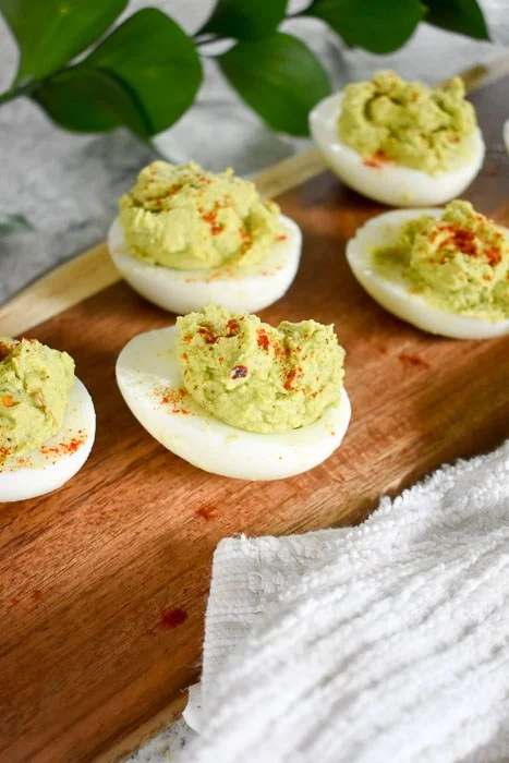 Spicy Avocado Deviled Eggs by Dash of Jazz