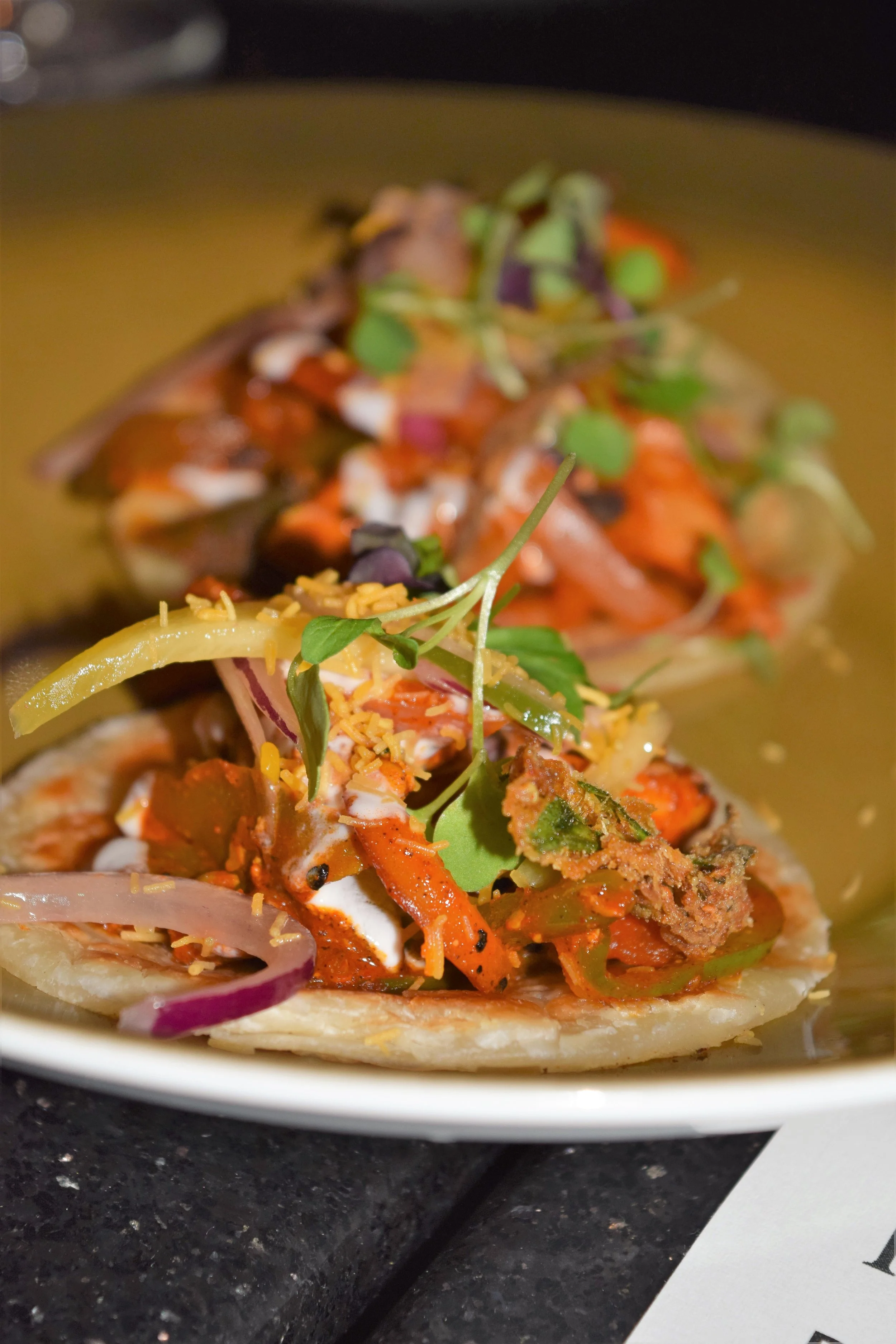ACHARI CHICKEN PARATHA (pickled chicken, fenugreek, mustard, red chili, vinegar, layered whole and wheat bread)