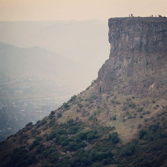 View of Castle Rock on South Table Mountain just after sunset (August 22, 2015). Two prominent basalt flows (62-64 Ma) are exposed at the crest of the hill or &quot;table&quot;. Note people (on top) for scale! || #basalt #geology #geography #geomorph