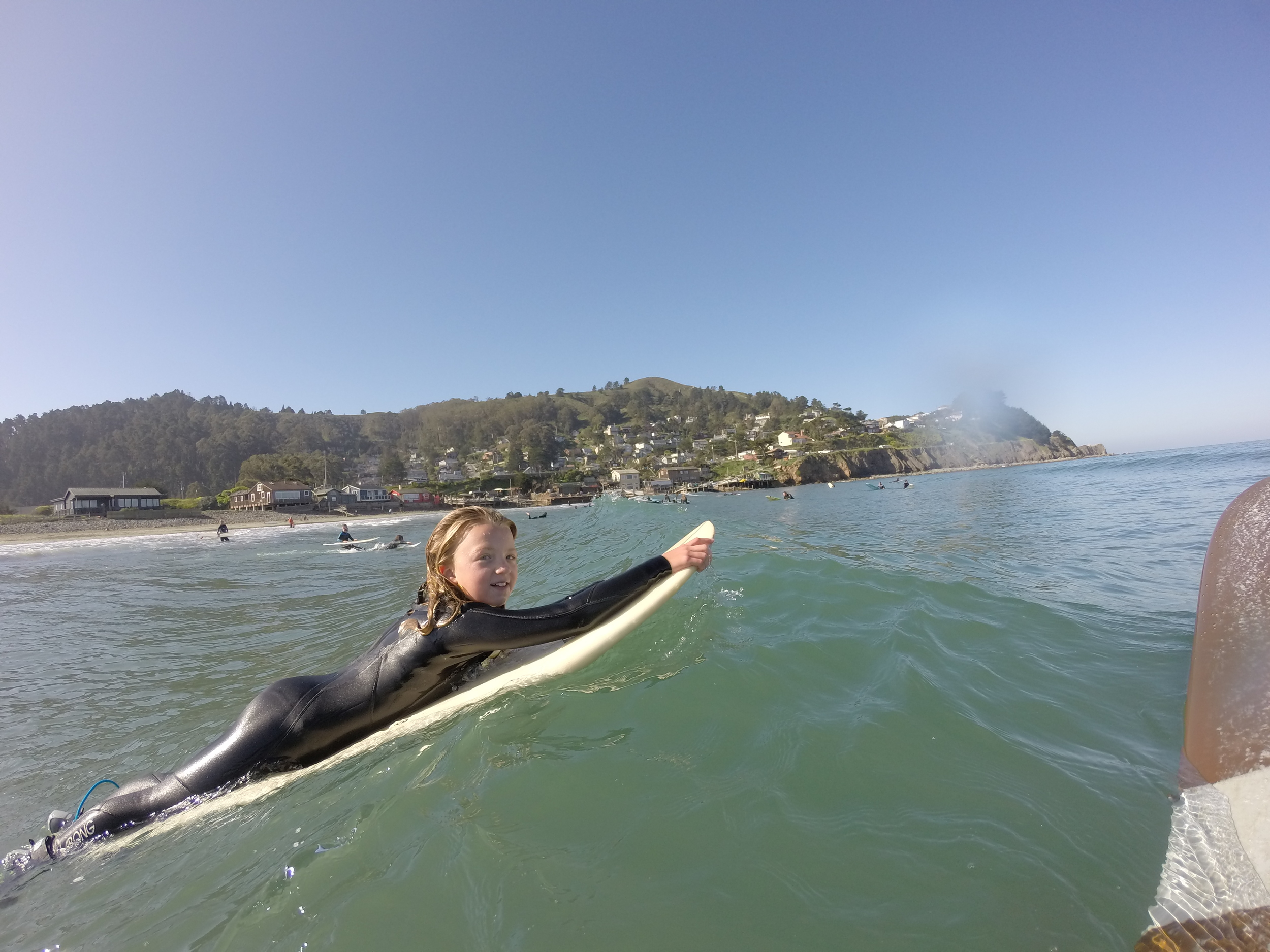 Caity going over a wave 