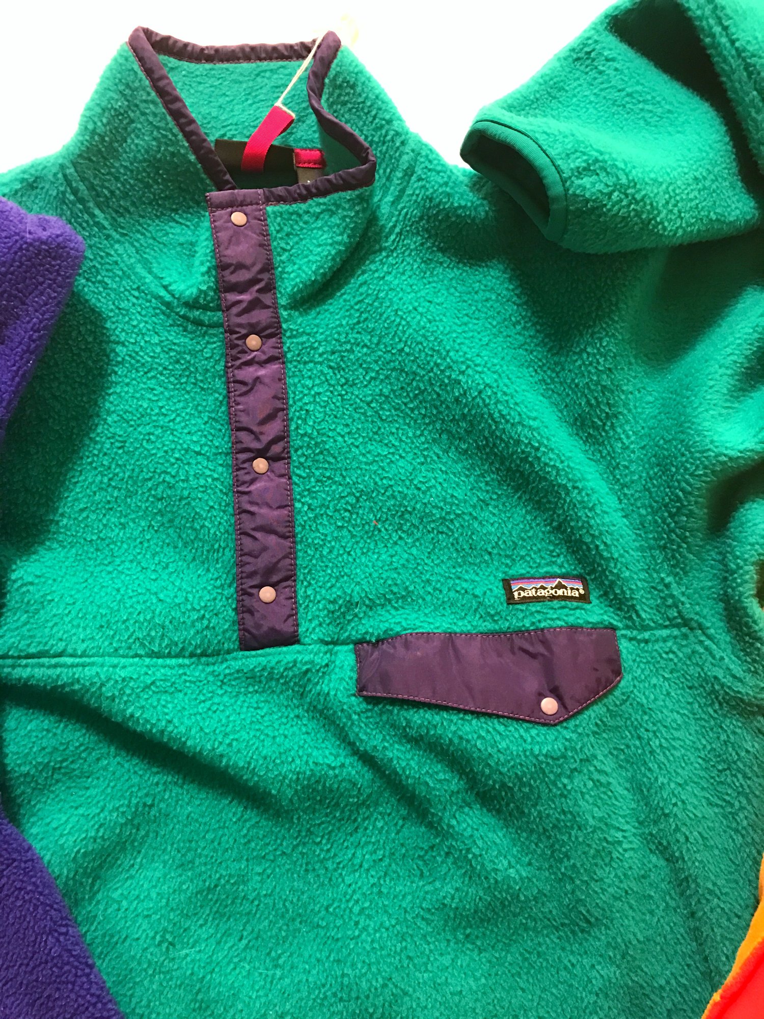 This early Synchilla Snap-T has been added to the permanent collection at MoMA . Of special note, the off-set snap on the chest pocket was designed by a member of Patagonia's sailing department. "It kept his sunglasses from sliding into his armpit," Laine explained. That shape continues to reappear in designs new and old today.