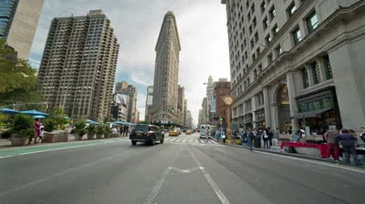 stock-footage-new-york-sept-flatiron-building-and-famous-clock-and-cars-and-taxi-cabs-driving-in-th.jpg