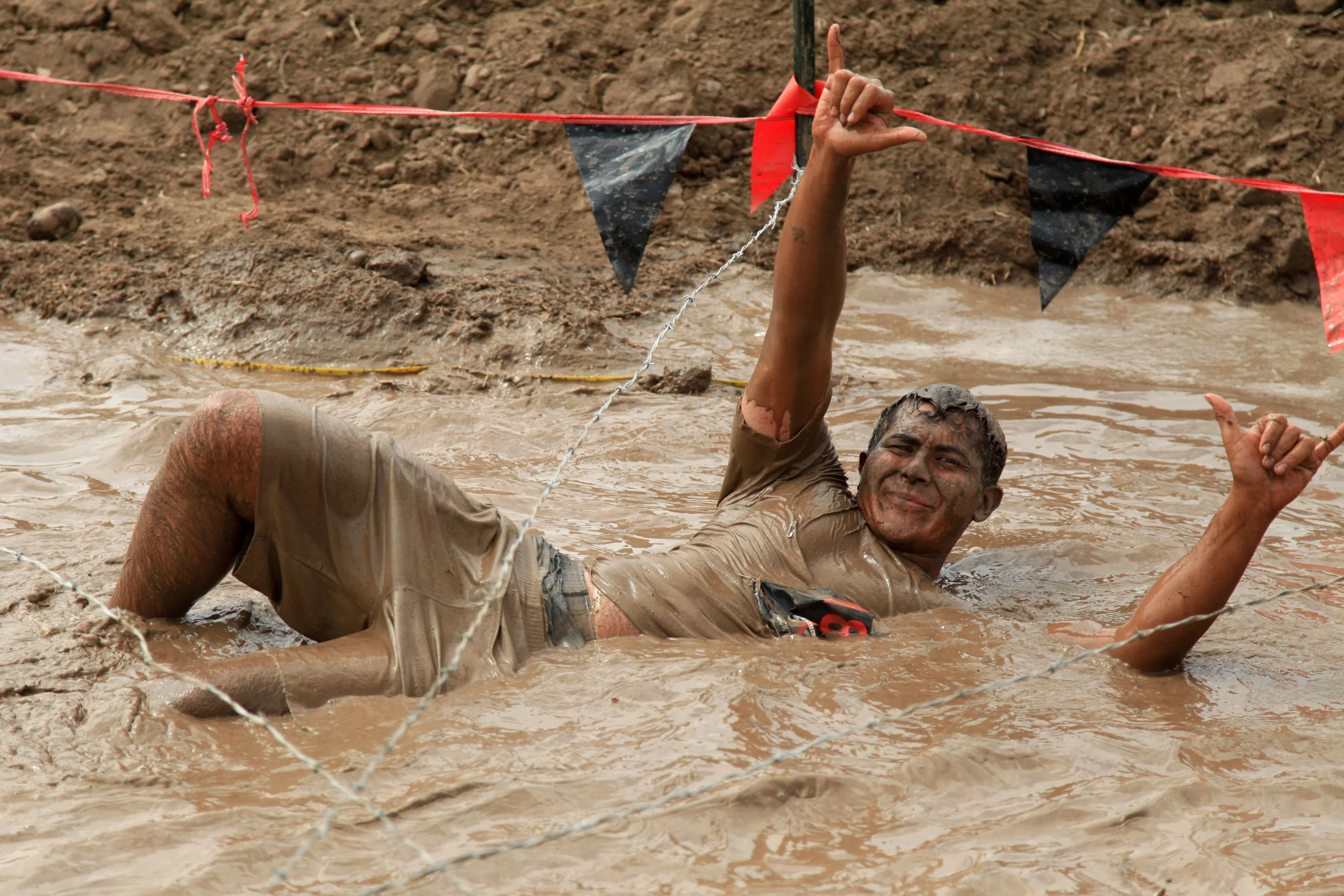 Irvine guy rock fingers in mud.jpg