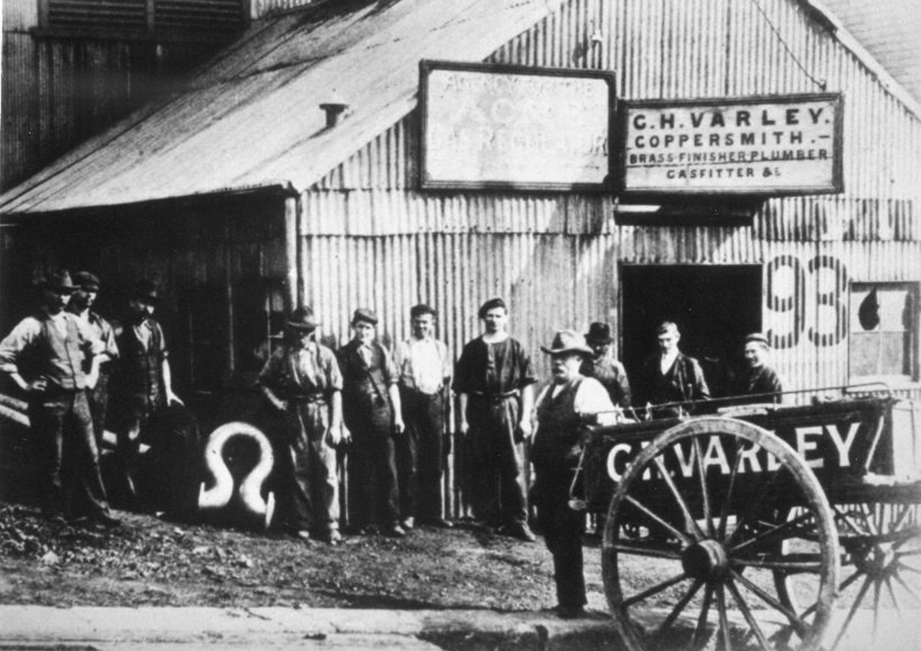 George Henry Varley (front) with the early staff members outside the King Street workshop.