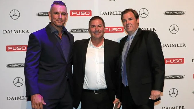 TOP DEALERS: (Left to right) RGM Maintenance Company Directors Greg Jackson and Russell Newman were presented the Daimler Truck and Bus Dealer of the Year award by Daimler Truck and Bus Australia Pacific President and CEO, Daniel Whitehead. Contributed