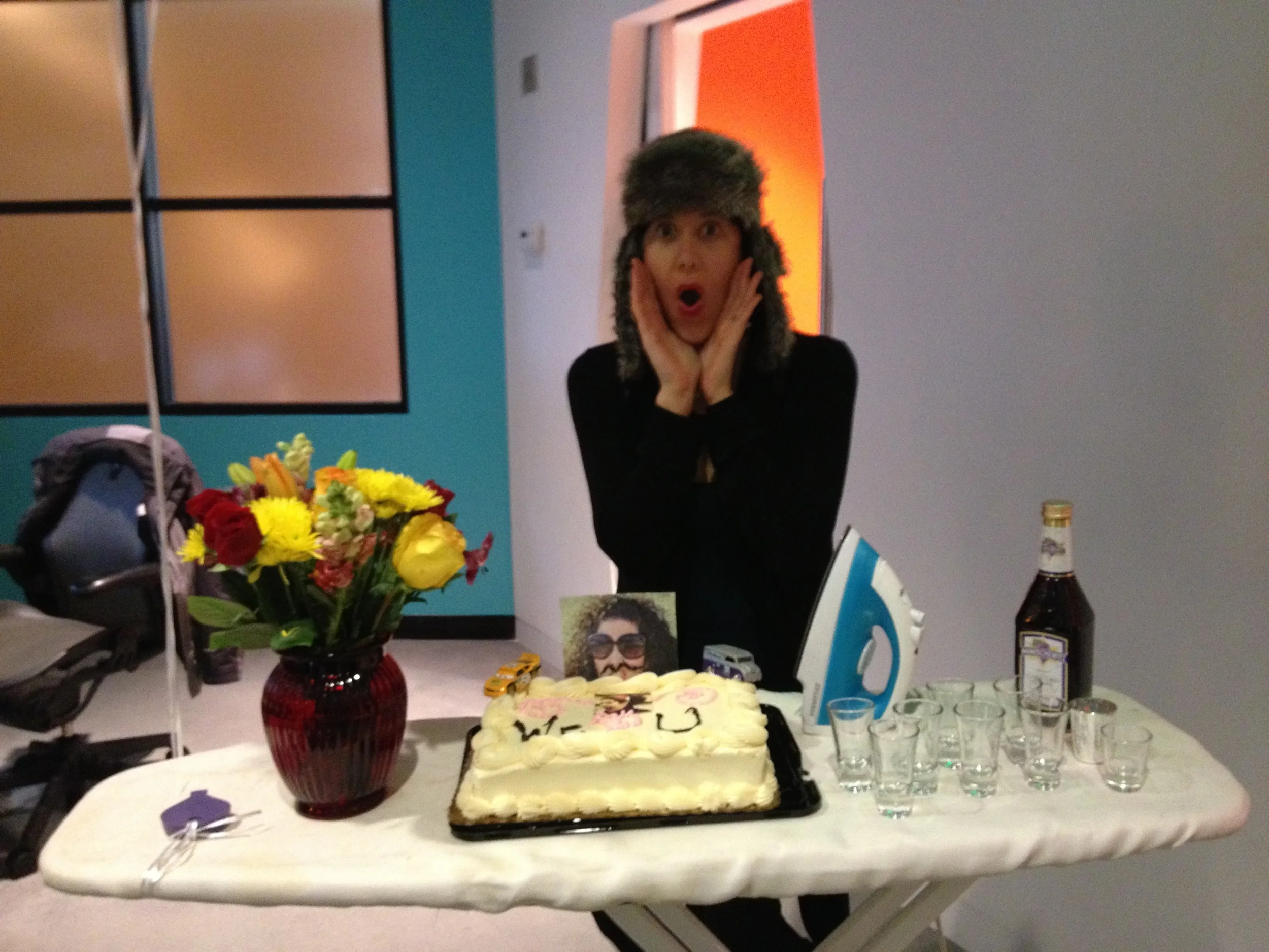 My going away party at TSG with a face cake, and shots of Manischewitz all displayed on an ironing board.