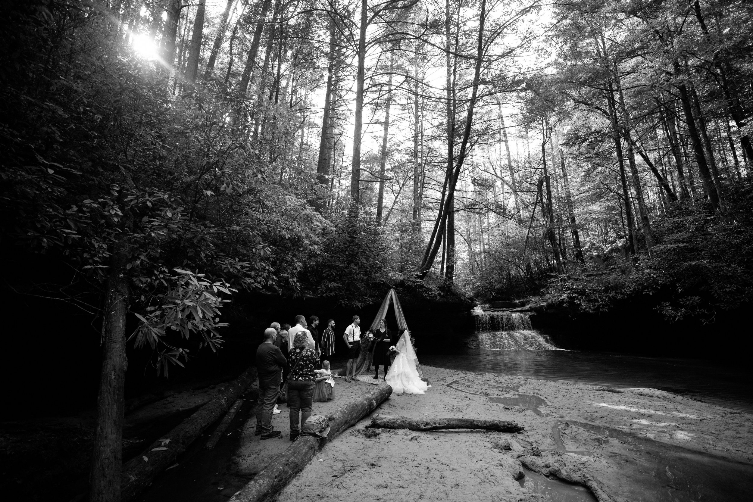  Eastern Kentucky wedding planners  Red River Gorge Weddings  coordniate an all-inclusive wedding ceremony in front of a waterfall in the Daniel Boone National Forest 