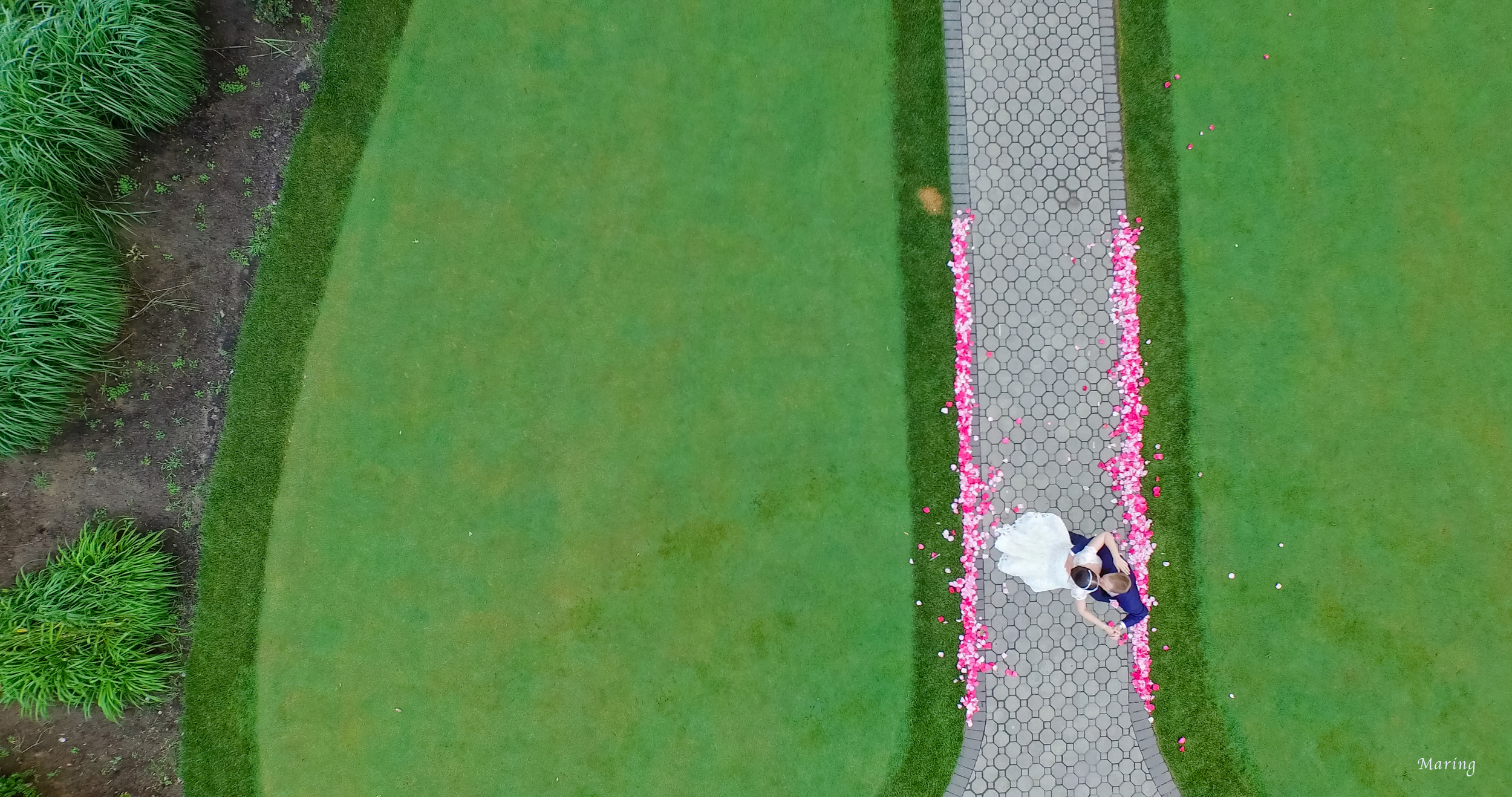 Aerial photographs are the next big thing in wedding photography, and rightfully so. Maring captured this beautiful moment at a wedding in Westchester New York on a golf course using the landscape as a creative point of view.