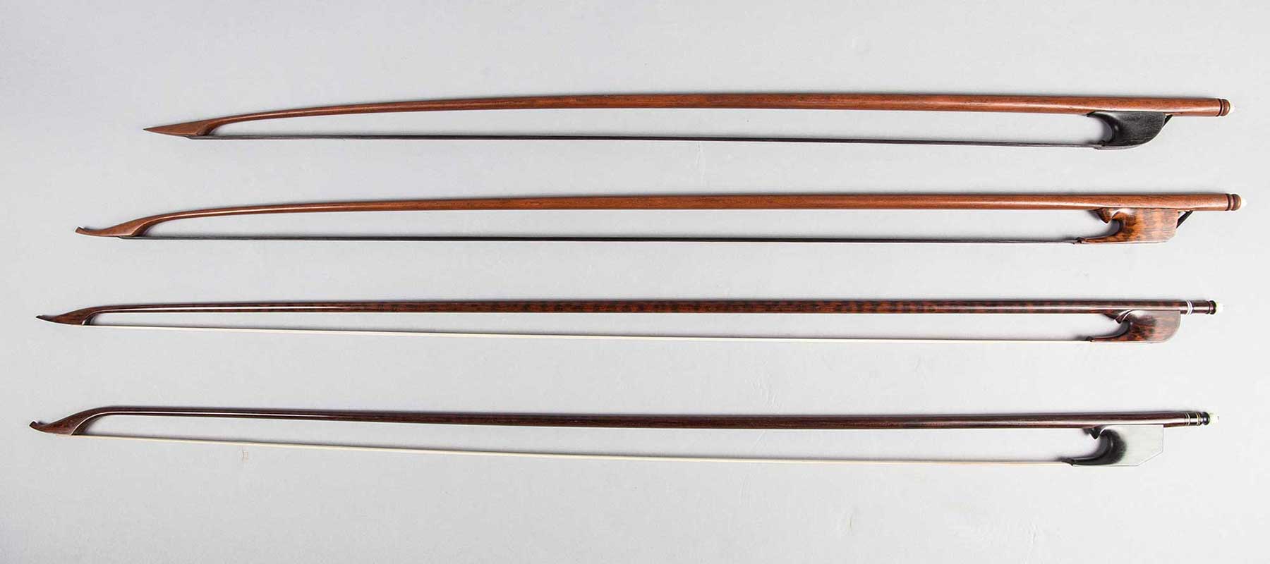 baroque violin, viola, and cello bows