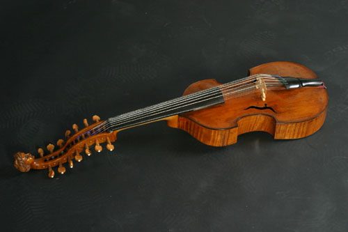 The viola d'amore is a 6 or 7 stringed instrument held under the chin and was popular in the Baroque era.