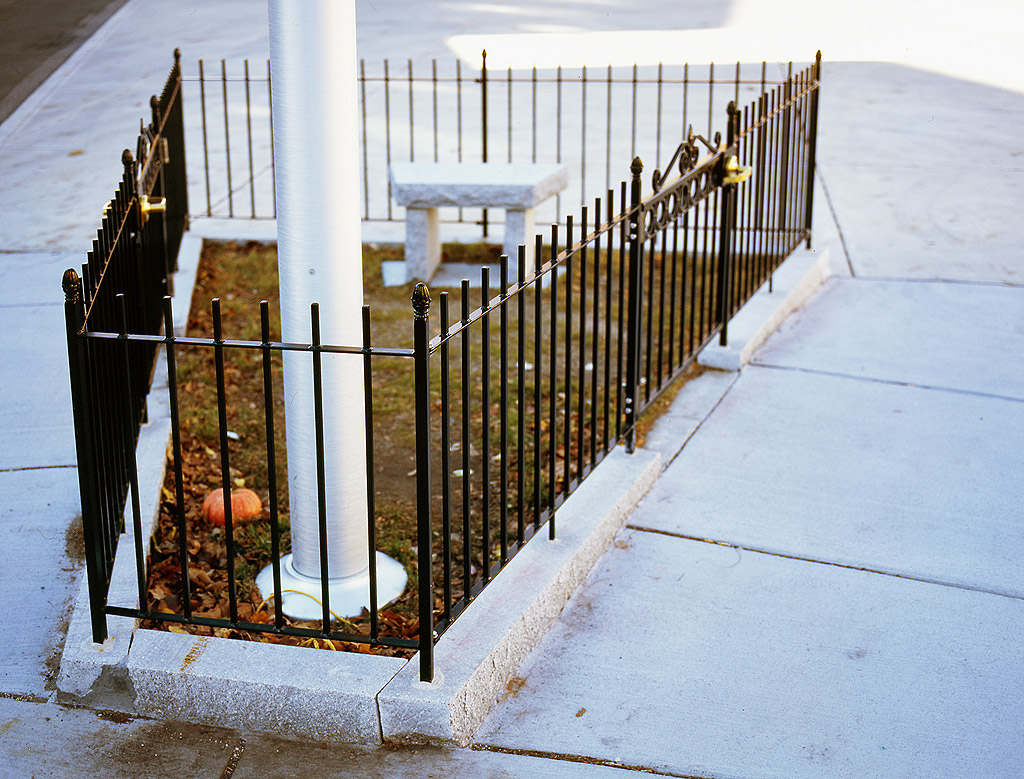 Taylor Square, 2011. Cambridge MA. Public park (fence, bench, flagpole, grass, public space) and 5,000 keys that open the park.