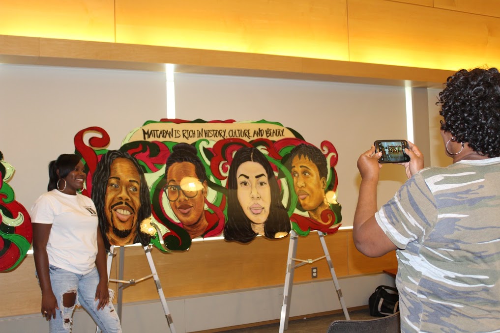 A proud member of the VIP Youth and Design Team smiles with Faces of Mattapan by Chanel Thervil. Photo provided by Chanel Thervil