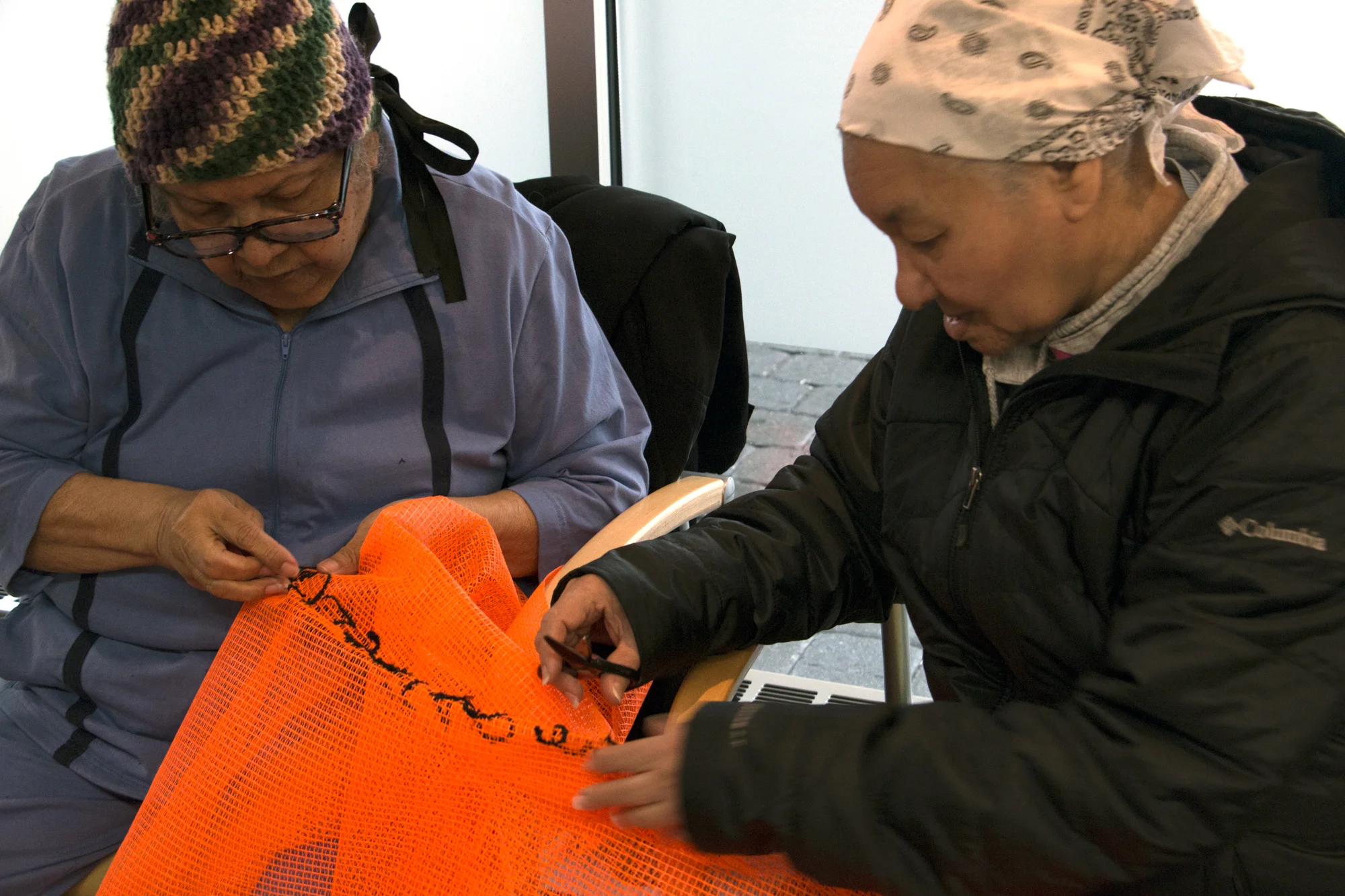 Members of the IBA community come together to help stitch and embroider the main tapestry of UNLESS.