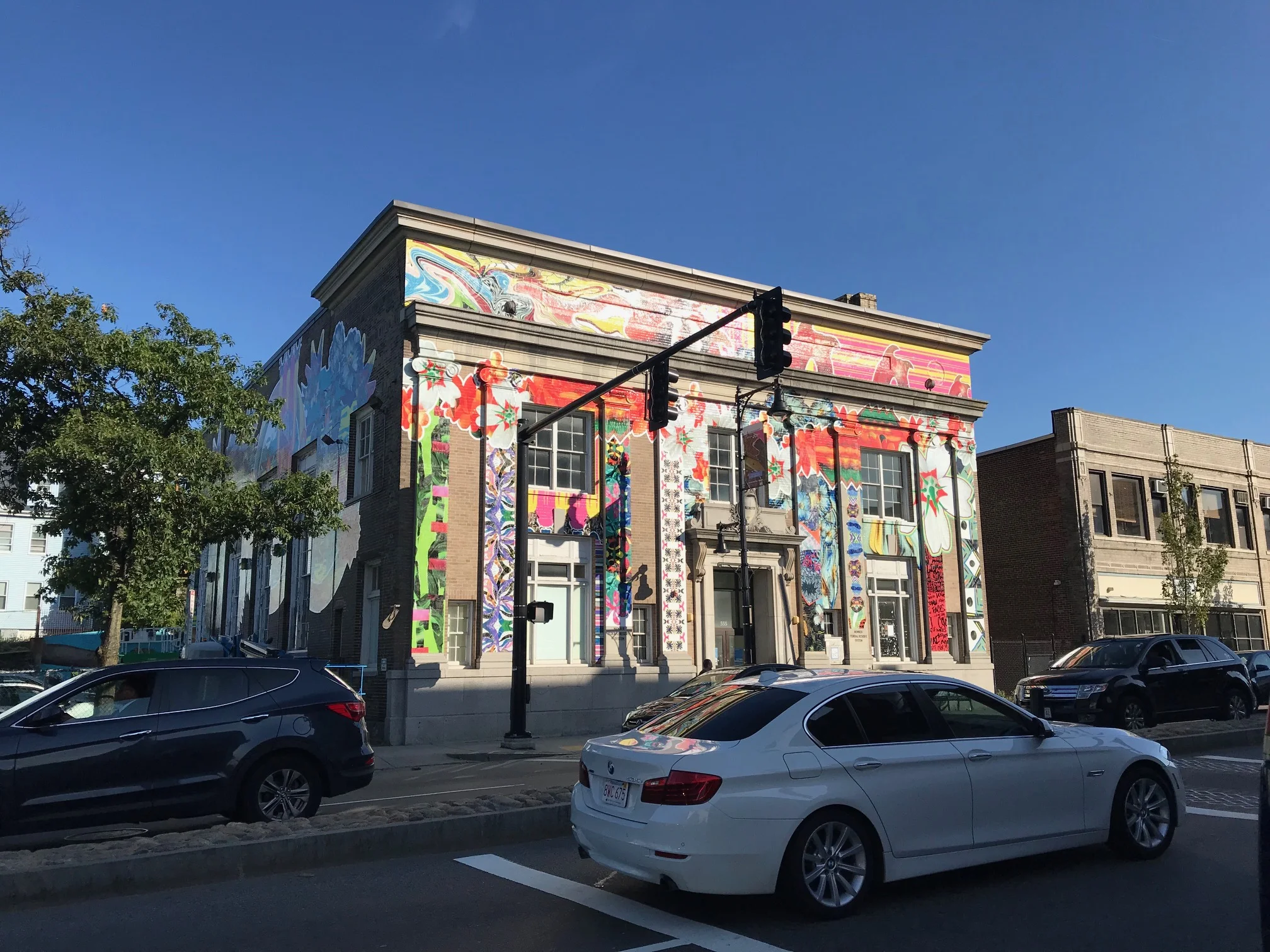555 Columbia Rd. adorned with artwork created by the neighborhood — awaiting the arrival of the Augment sculpture for installation.