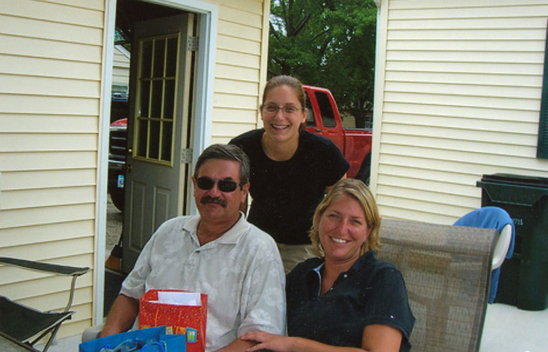   Paul and his daughters Stephanie (standing) and Heather.  