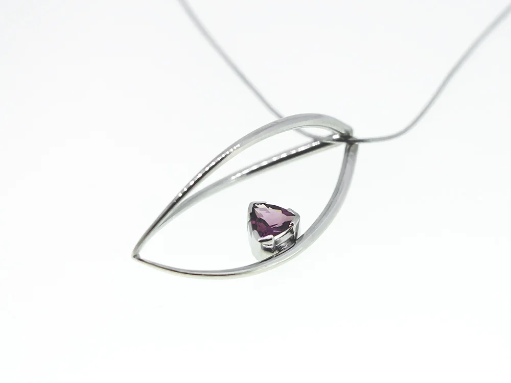 18 Carat White Gold With Trillion Pink Tourmaline.