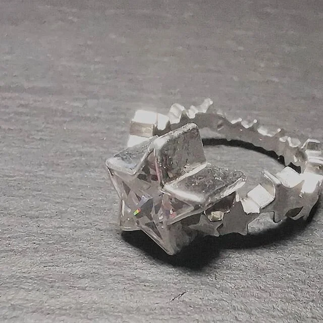 Oh man... What do I call this ring. 🤔😏 #allstar #star #starjewelry #starjewellery #sterlingsilverjewelry #silverjewellery #cz #cubiczirconia #ruboversetting #geometry #stonesetting #christmas #hajewellery #nocolonstillrollin