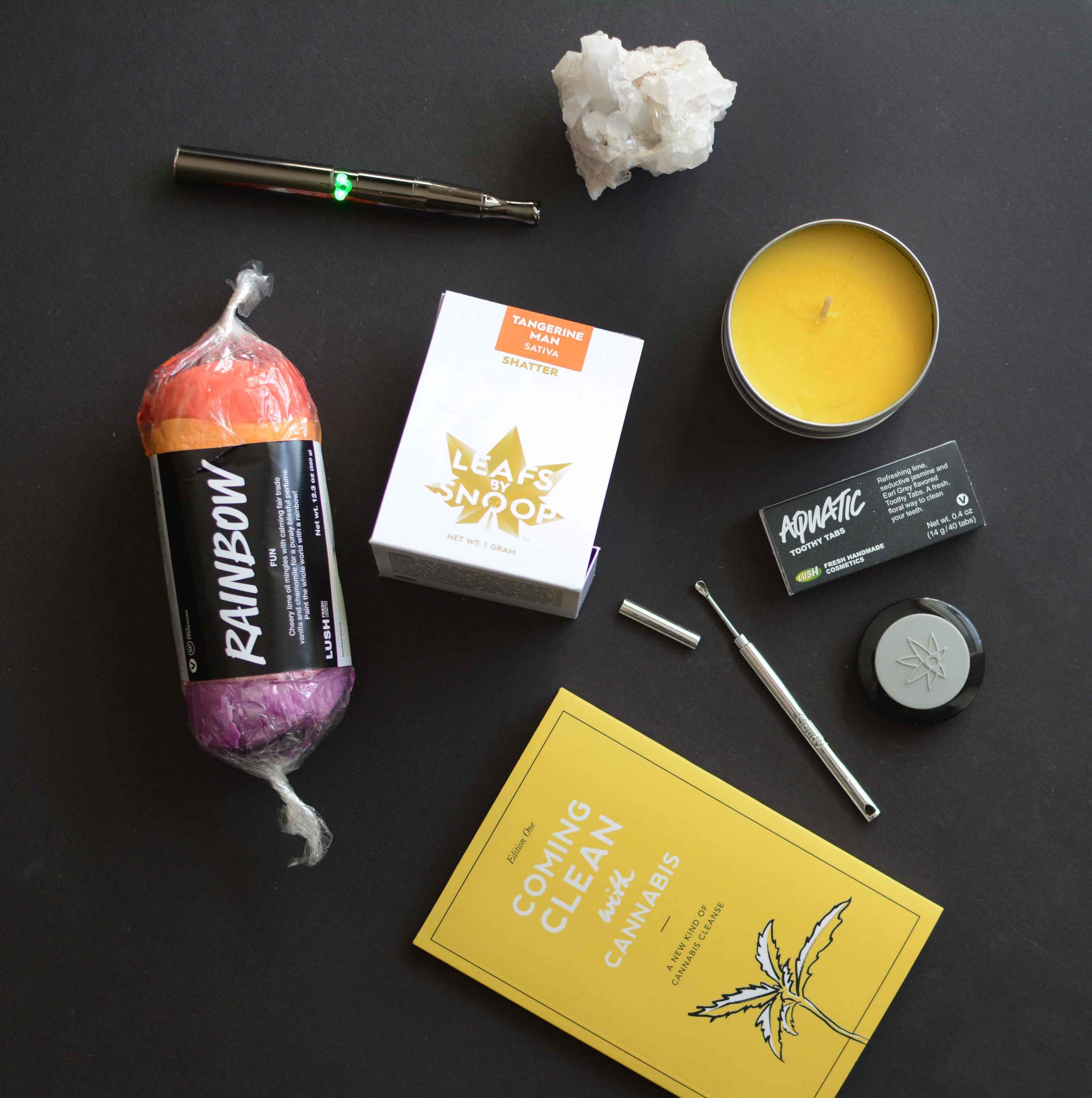 Rainbow Moldable Soap from Lush Cosmetics / Puffco Concentrate Vape Pen / Leafs by Snoop Tangerine Man Shatter from LivWell Dispensary / Coming Clean with Cannabis free downloadable ebook / Capped Dabber from Cloud Vapes / Wax Wallet by 420Science from Retroactive / Aquatic Toothy Tabs from Lush Cosmetics / Lemongrass and Parsley Candle from Hobby Lobby