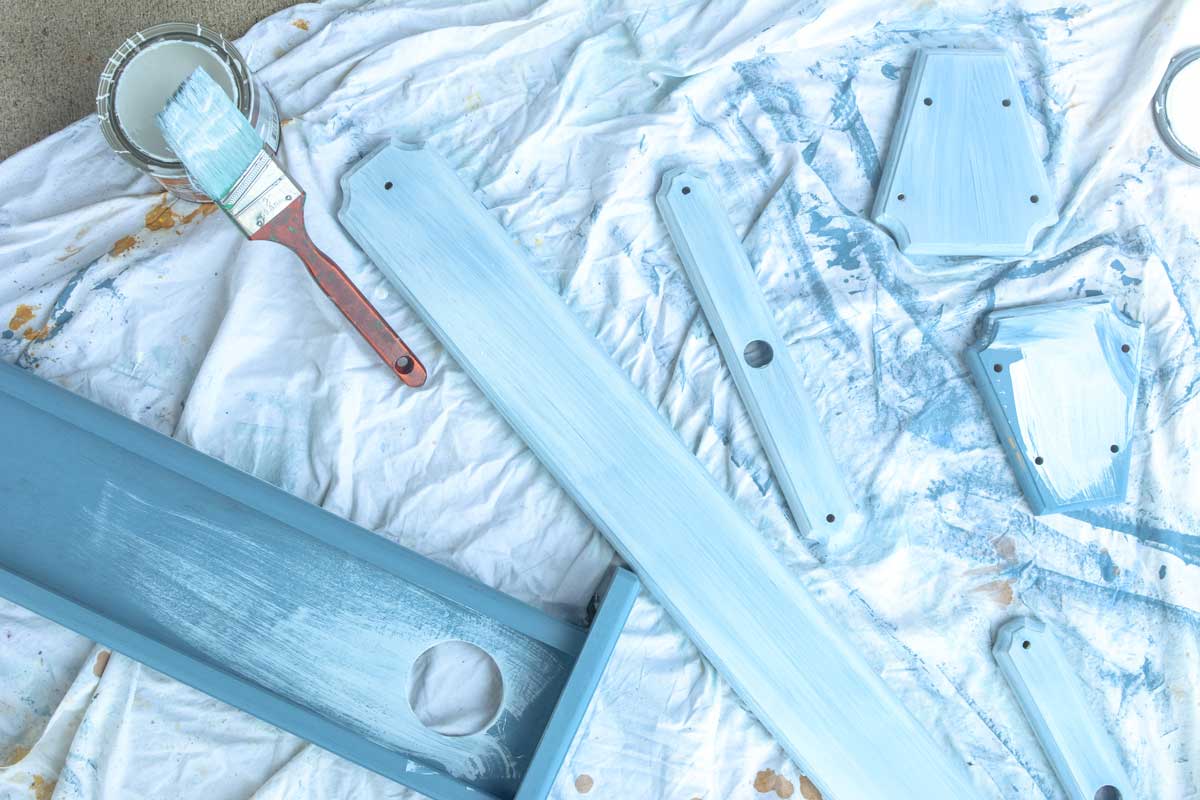 I then painted each piece blue; the same blue that I had used to make one of our three official Hempsley backgrounds. 