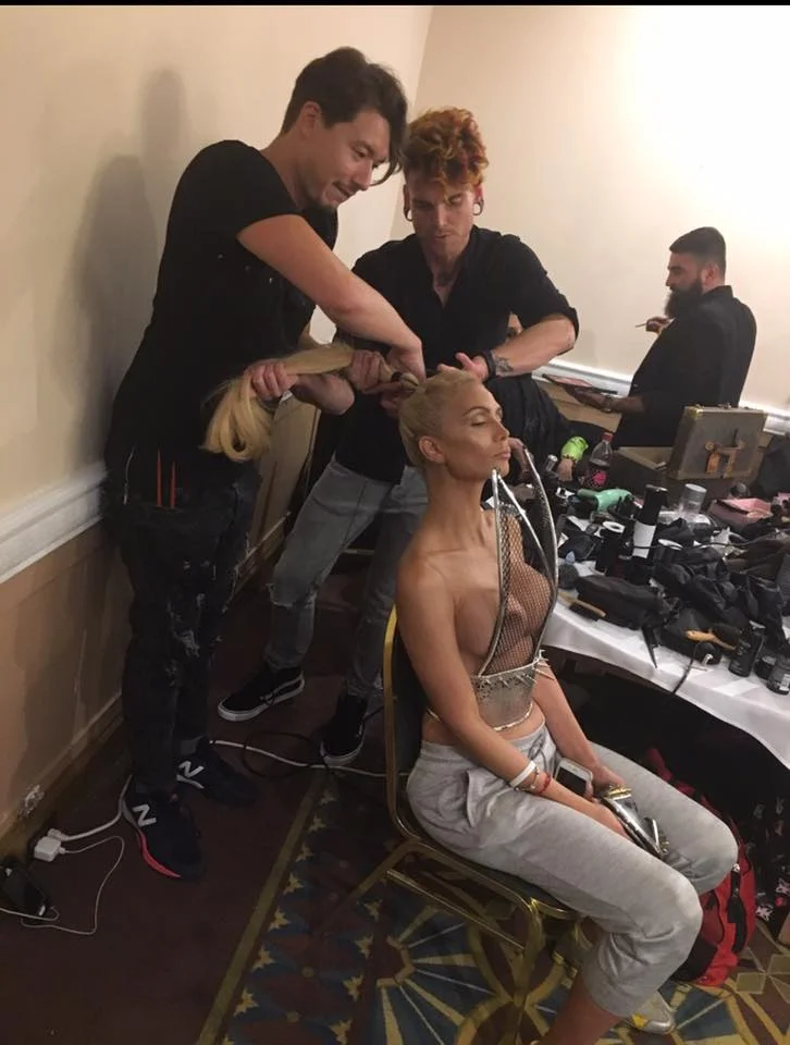 Matthew Tyldesley and Jake Walker creating a high pony on model, Claudia.