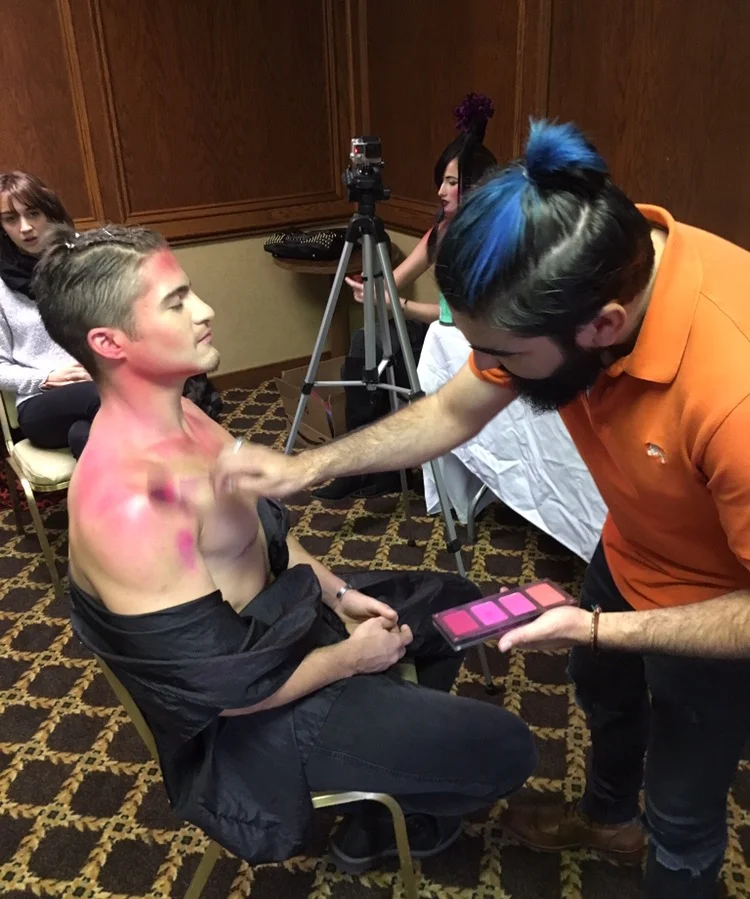 Isidro doing make up on Max
