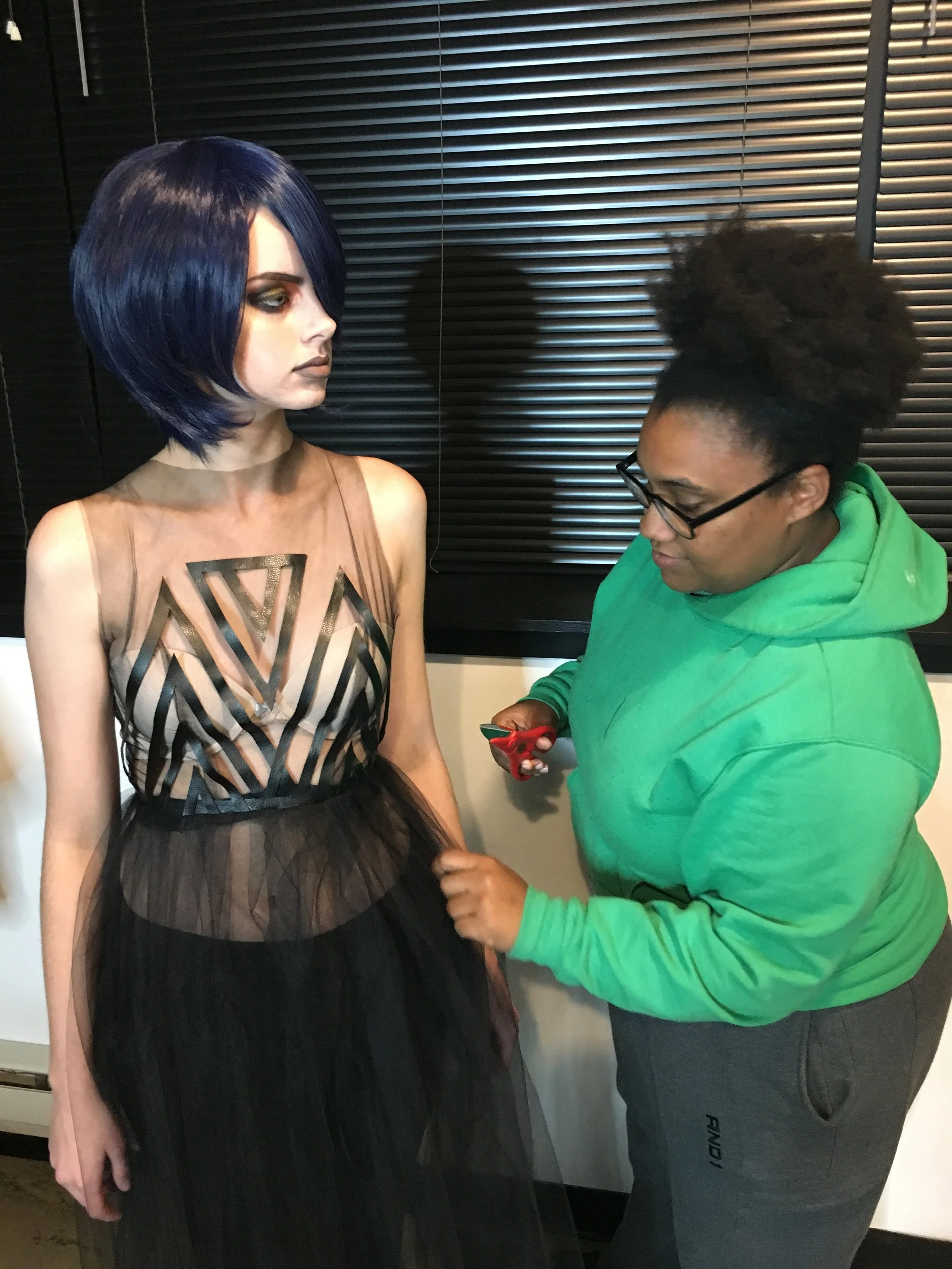 designer Frances Lewis final touches on her gown