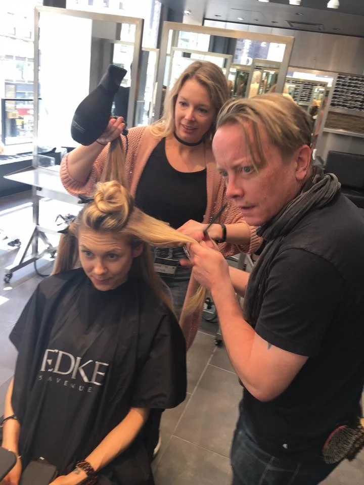 Noah assisting Danette on hair