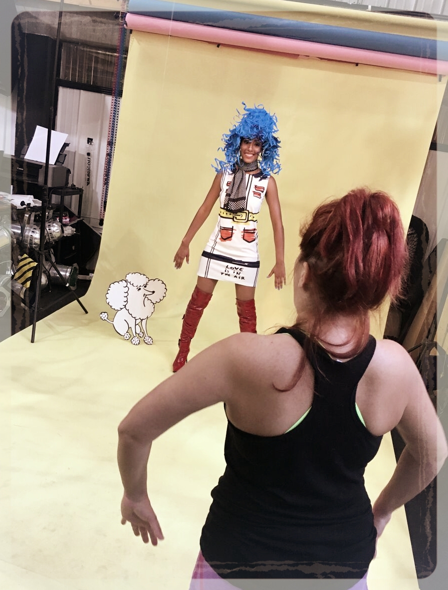 Genna directing model Briana on set with “Paula” the paper poodle