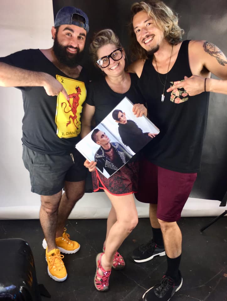 the team posing with a copy of Obscurae
