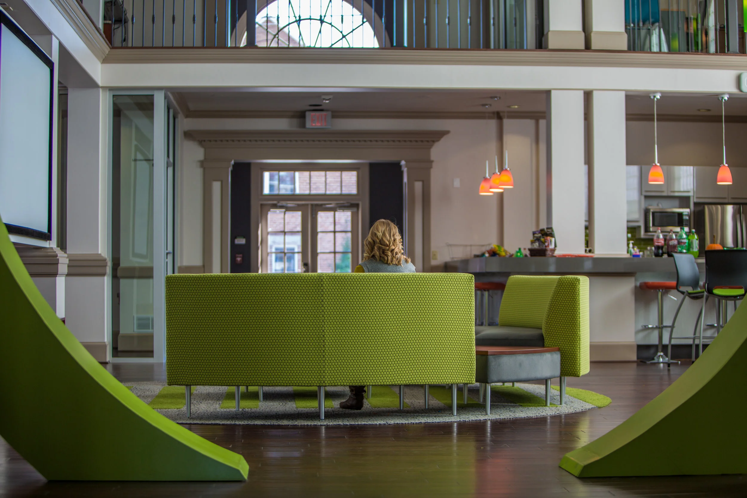 Lobby Through Logo w Sarah.jpg