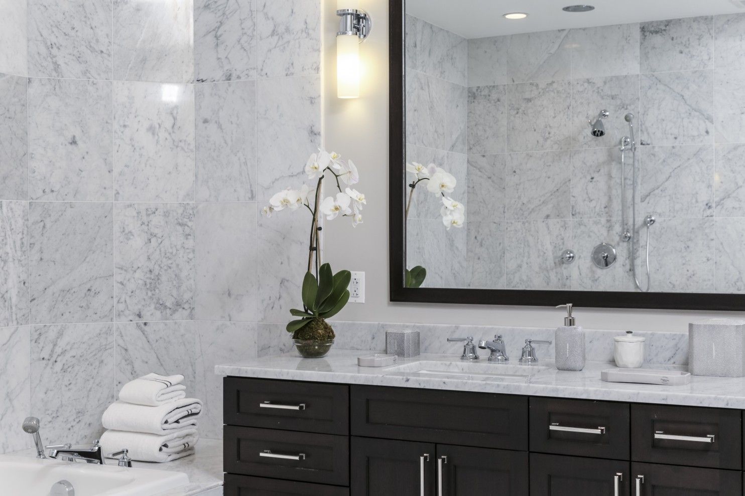 All the bathrooms have Carrera marble sinks, tub and shower surrounds and floors. (Benjamin C Tankersley/For The Washington Post)