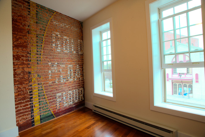 Restored brick wall in contemporary apartment