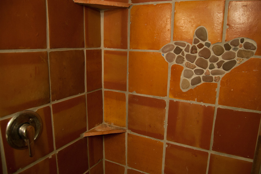 Terra cotta tile with pebble inlay