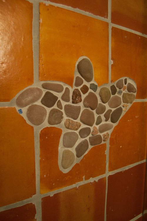 Terra cotta tile with pebble inlay