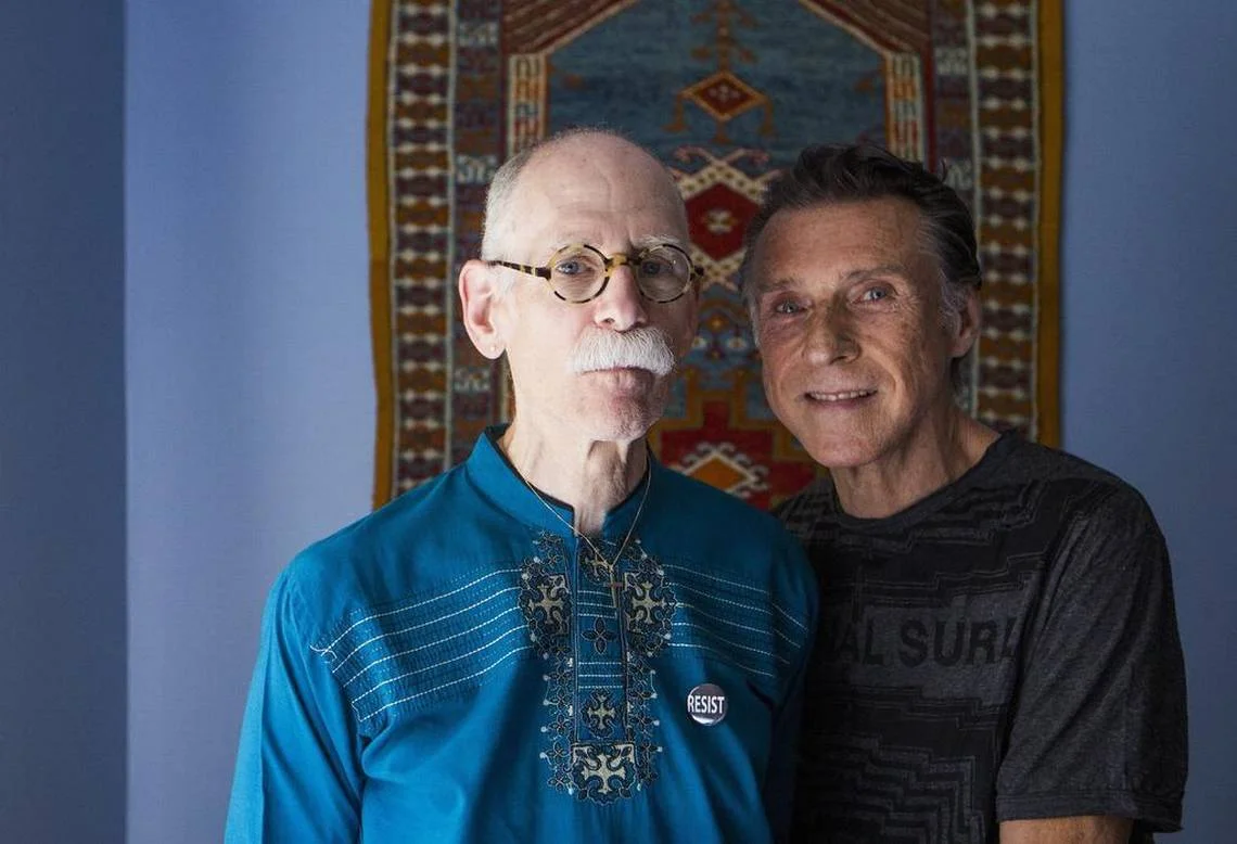 “When I retired I stopped wearing Western clothing, Christopher Ross, left, said after a portrait session with his partner Allan Keech, left, at their home in Durham. They will soon be living in the Village Hearth Cohousing community, to be built next year. It is a place where members of the LGBT community will be welcome among their peers and allies. Casey Toth ctoth@heraldsun.com