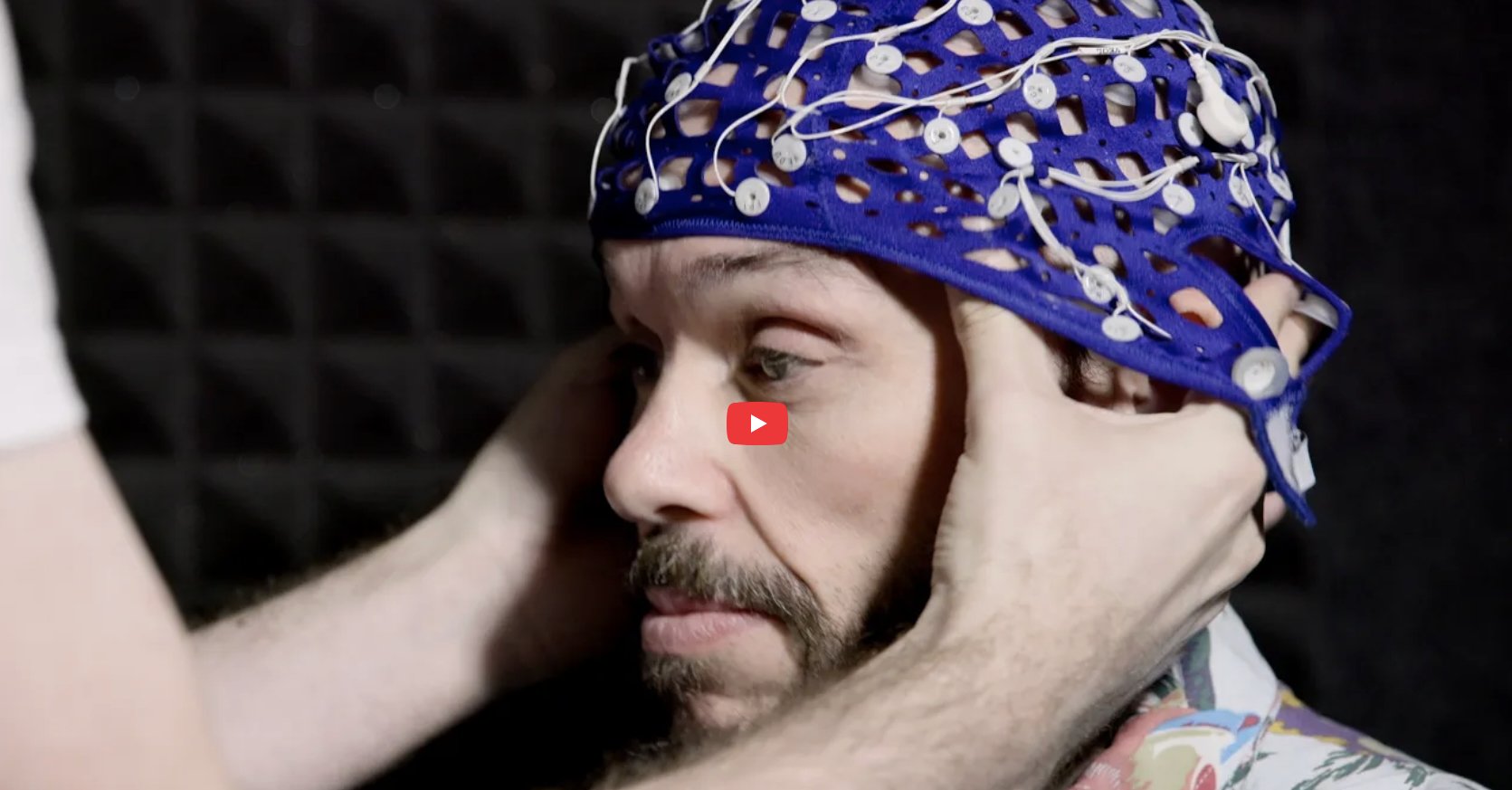 Video thumbnail with man getting a brain scan cap put on his head