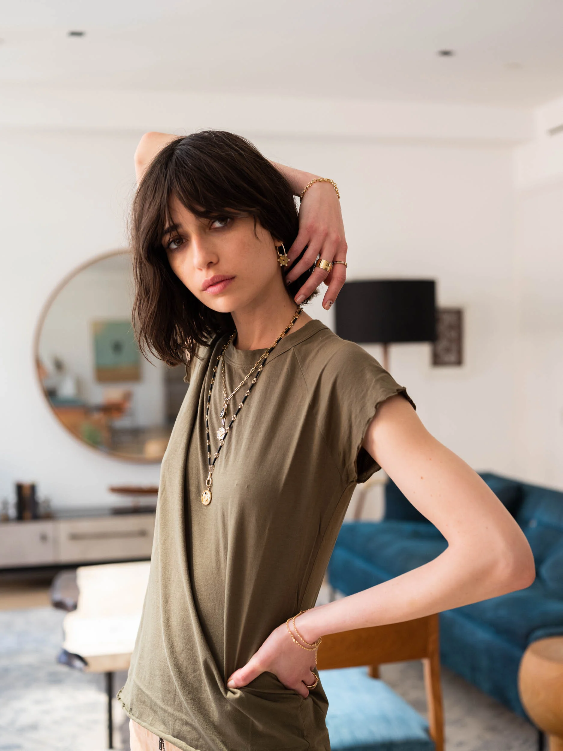 Photograph of a woman wearing a Foundrae gold necklace