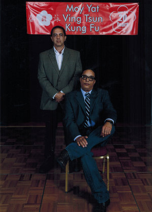 Sigung Moy Yat Tung (left) with his Sifu, Grandmaster Moy Tung (seated).