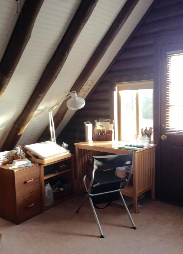 Vicky Williamson My loft studio in our log cabin -- no water supply up there so I keep a couple of jugs of water handy, and a compost bucket to dump dirty water into. Easy to carry down the steep ladder-stair to empty.