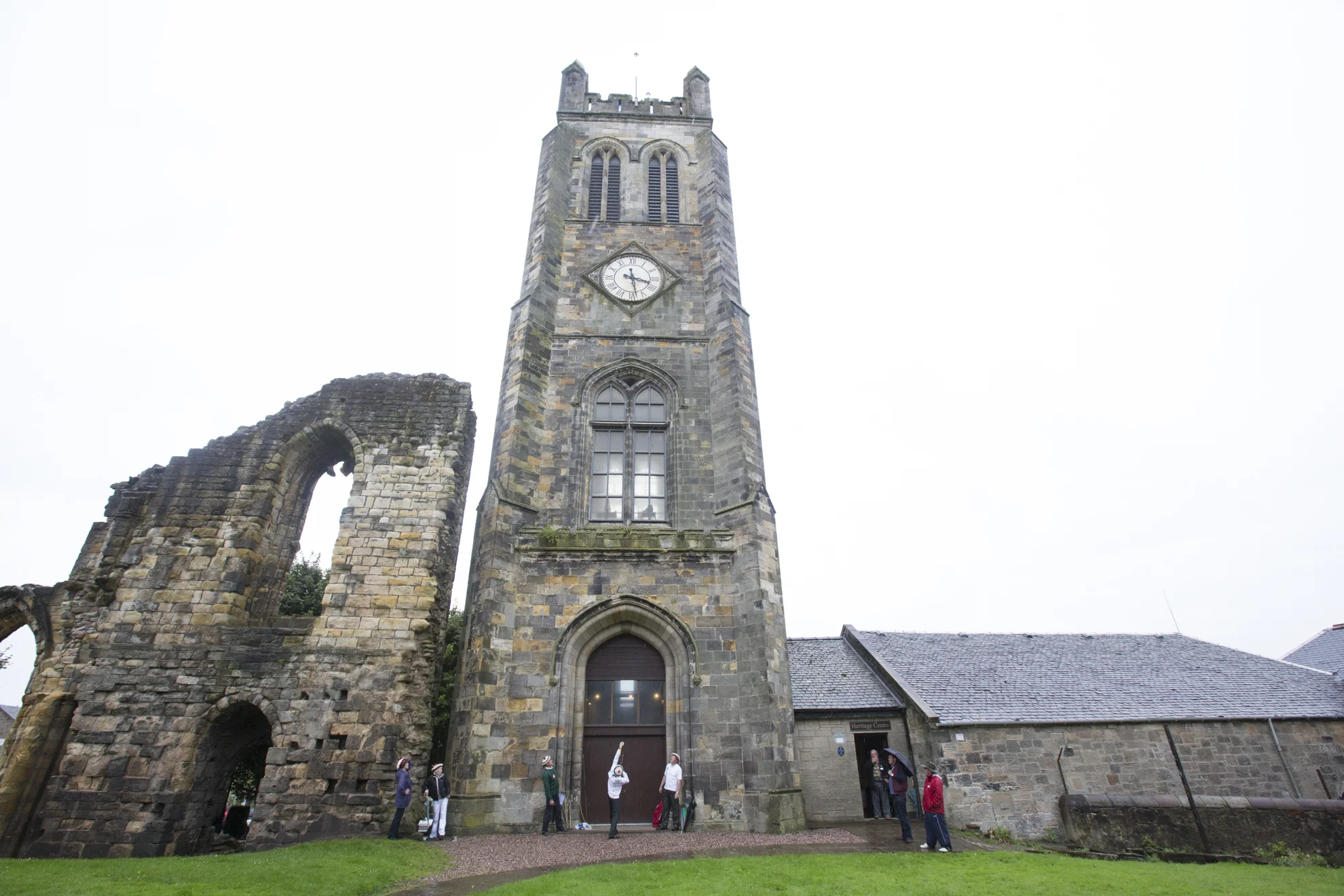 Andrew Arcaro, a member of the Ancient Society of Kilwinning Archers, aims using a longbow and arrow for the wooden pigeon at the top of the Kilwinning Abbey Tower during the open Papingo in Kilwinning, Scotland.