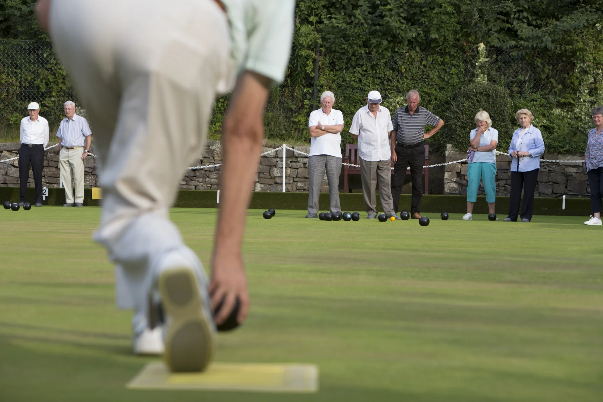 Peter Brodie bowls during a casual game at Blackhall Bowling Club in Edinburgh, Scotland.