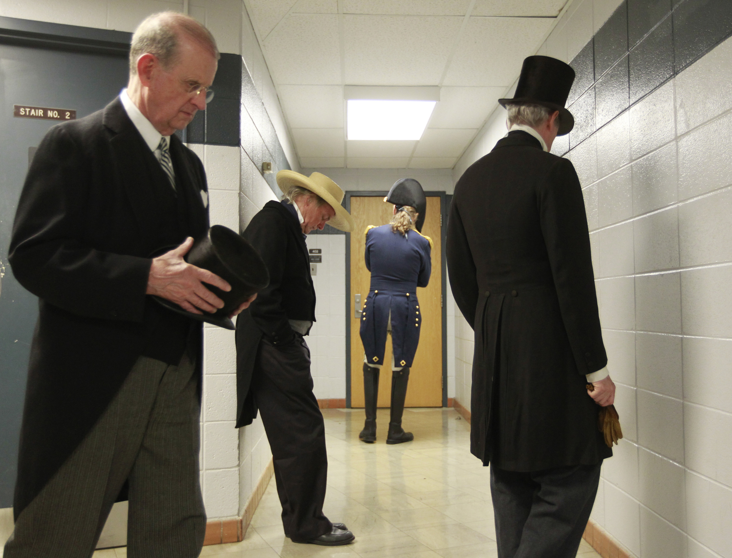  From left, Bill Young, portraying President Woodrow Wilson, Stephen Moore, portraying President Zachary Taylor, Frank Margargee, portraying President William Henry Harrison, and Richard Cheatham, portraying President John Tyler pace outside room 402