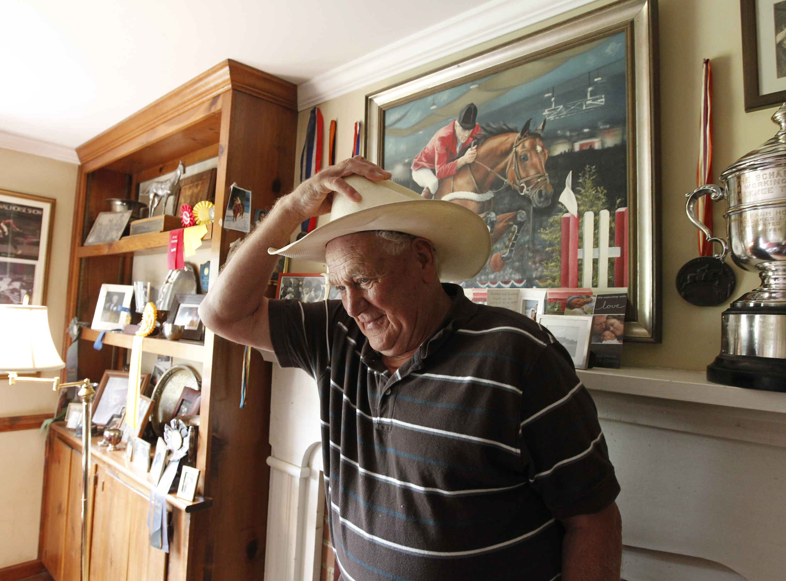  Harry de Leyer gets ready to go to the horse stables on his farm where he trains jumping horses and riders. Copyright: The Daily Progress    