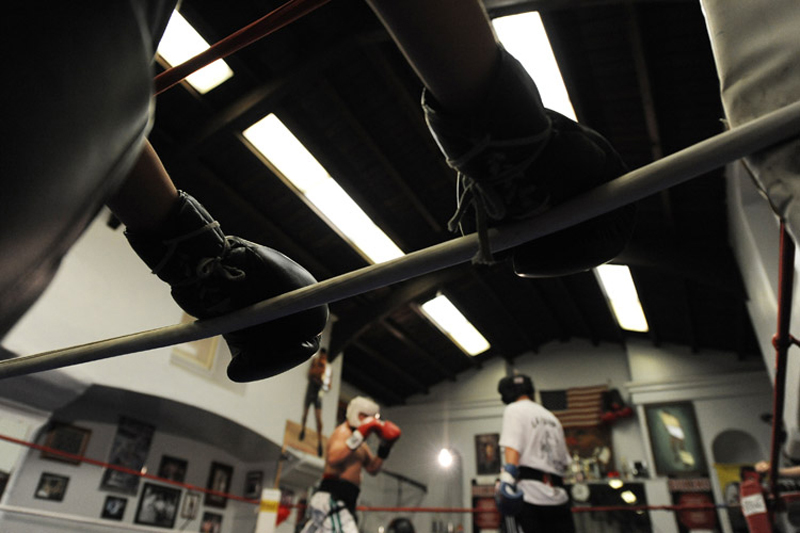  Boxers wait around the ring at the center of La Habra Boxing Gym in La Habra, Calif. Saturday, April 10, 2010.    