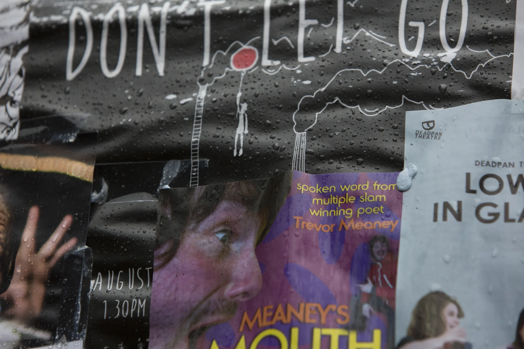 Rain hits posters during the 2014 Edinburgh Festival of the Fringe in Edinburgh, Scotland.