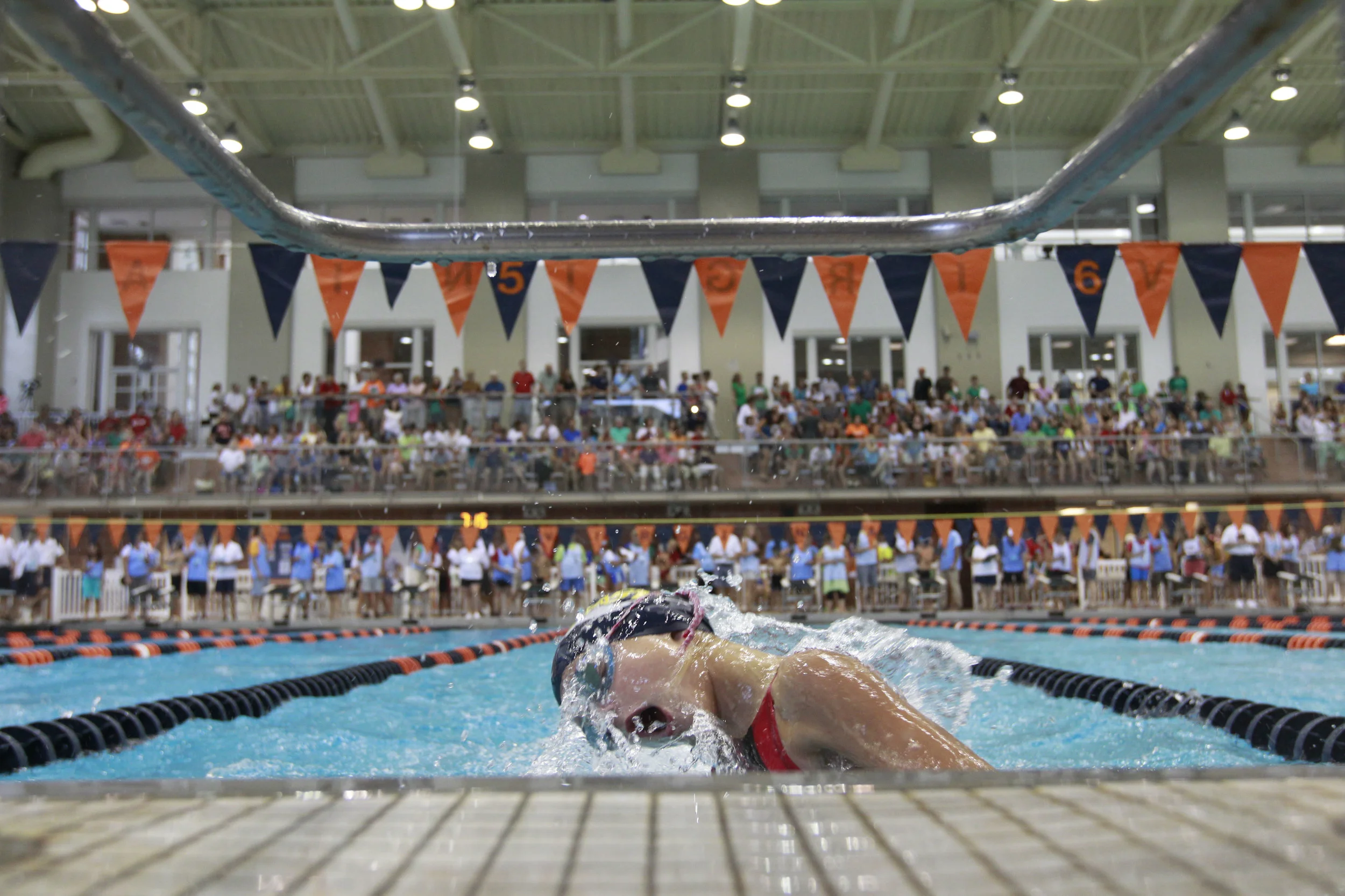 Fluvanna Aquatics Sports Team swimmer Abigail Brown turns at the wall in the final heat of the girls 9-10 year old 50 yard butterfly Saturday, July 27, 2013 during the Jefferson Swim League Championship at the Aquatic & Fitness Center at the University of Virginia. Copyright: The Daily Progress