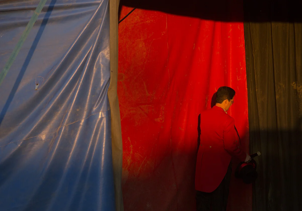 Ringmaster John Moss II enters the circus tent.