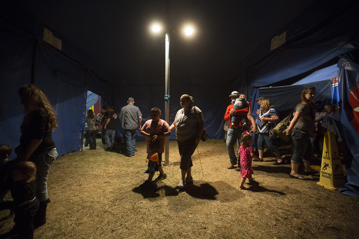 Customers walk through the exit of the Kelly Miller Circus after the end of anothe show.