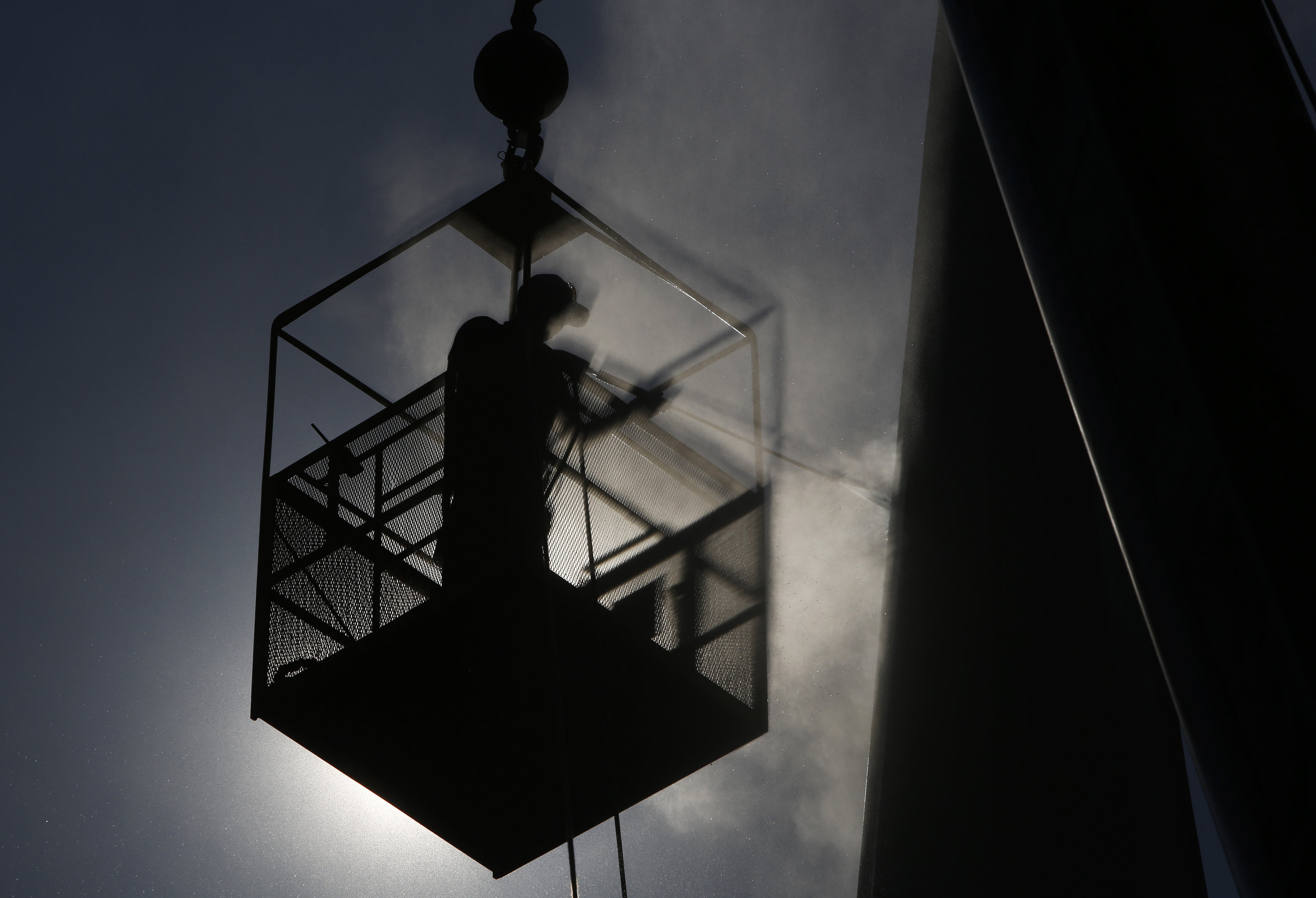  Trevor Ronan power washes the steeple at Yorkminster Presbyterian Church Wednesday, August 31, 2016. The top is approximately 80 feet from the ground. The power washing service was volunteered by Ronan's father's company, George Ronan Powerwash. Cop